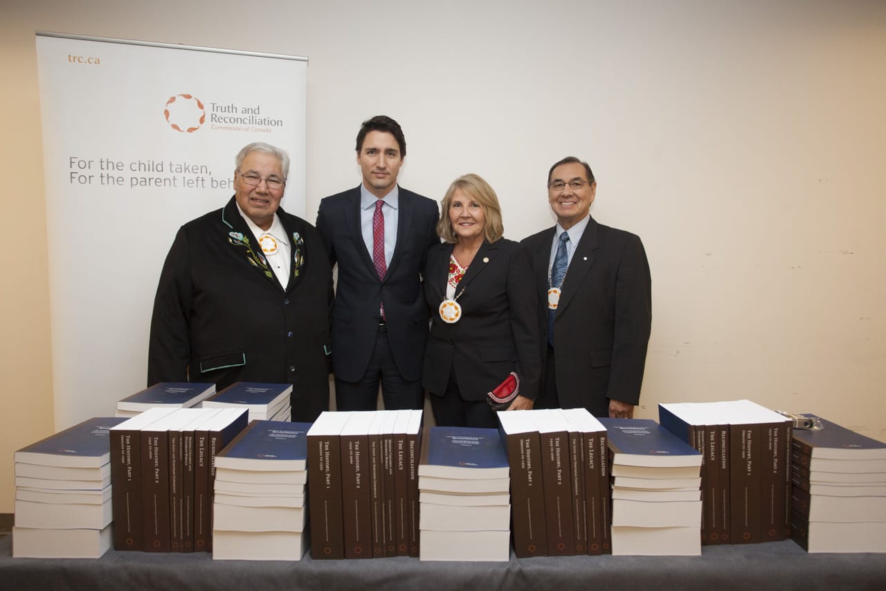 TRC reports on table in front of Commissioners and Prime Minister