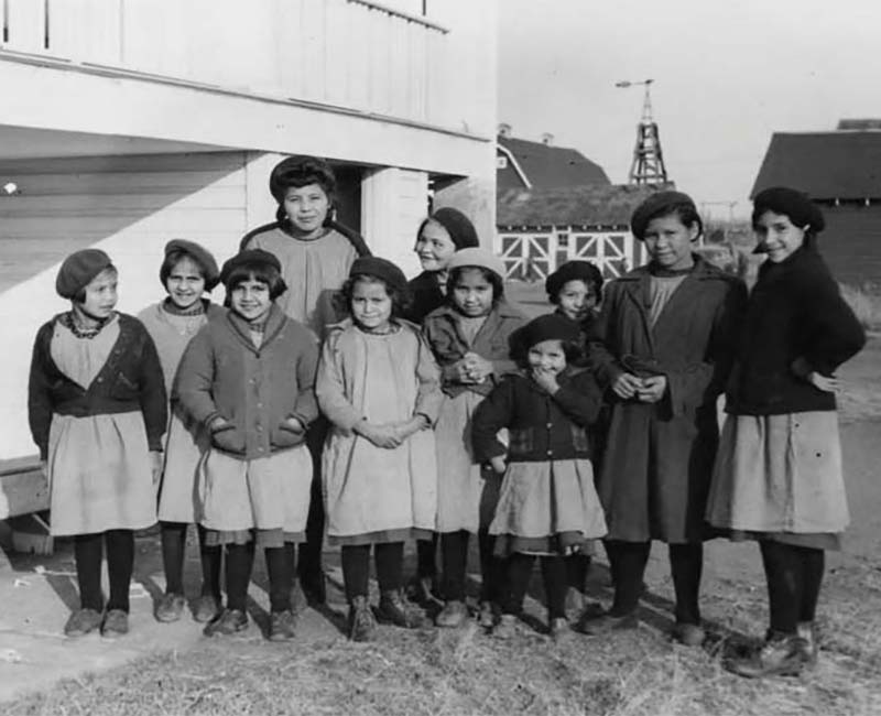 Group of people outside of St. Anthony's Sacred Heart school