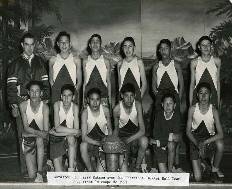 Basketball players posing for photo at St. Mary's Blood school 