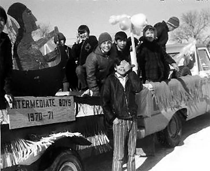 Group of students in parade outside at St. Michaels Duck Lake school