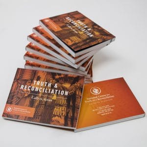 A stack of mini booklets of the Truth & Reconciliation calls to action.