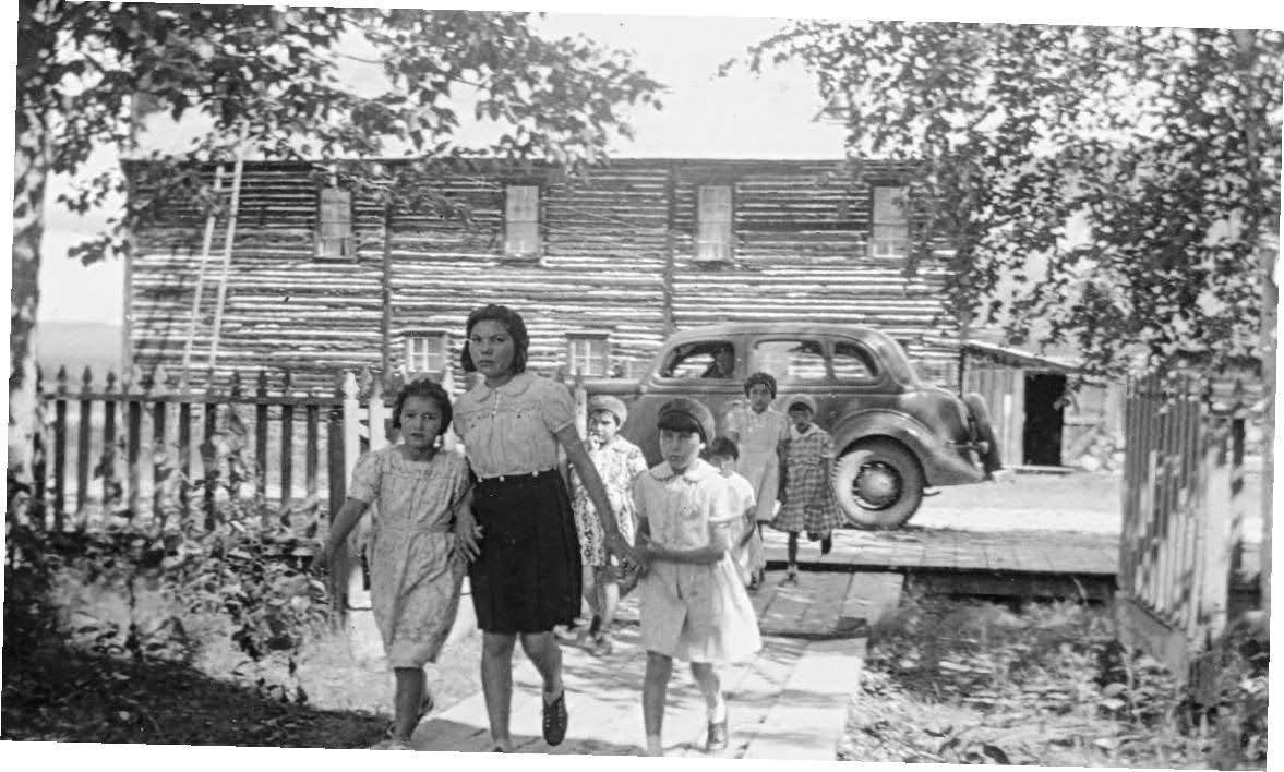 Group of people outside building walking from car