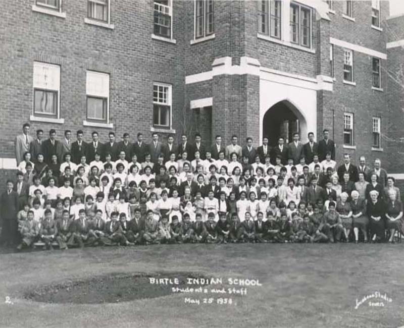 Group of students and teachers in front of Birtle school 