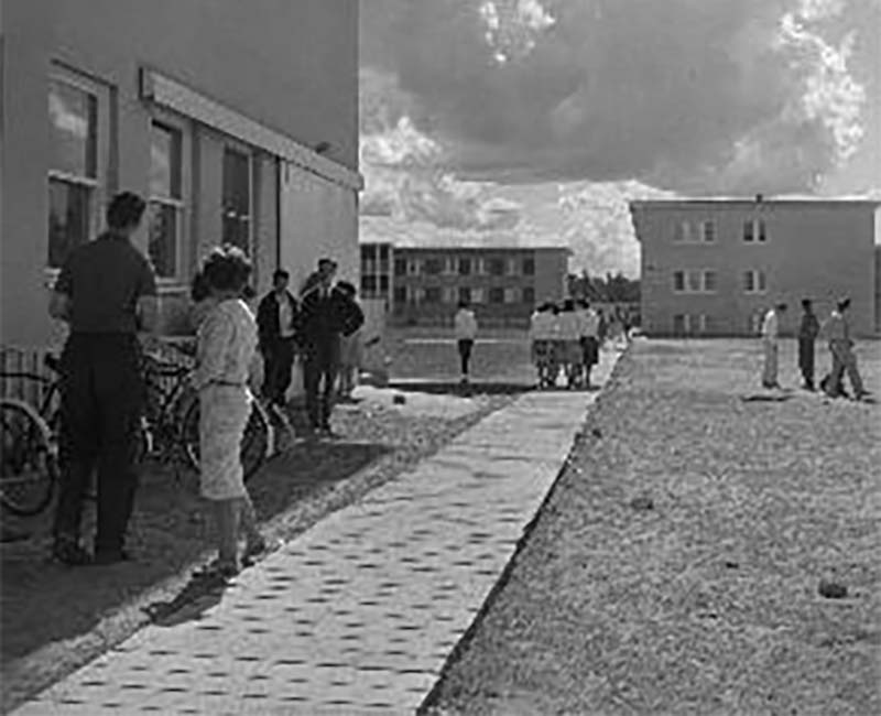 Groups of people outside at Breynat Hall buildings