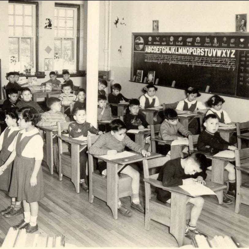 Students in sitting in desks in classroom 