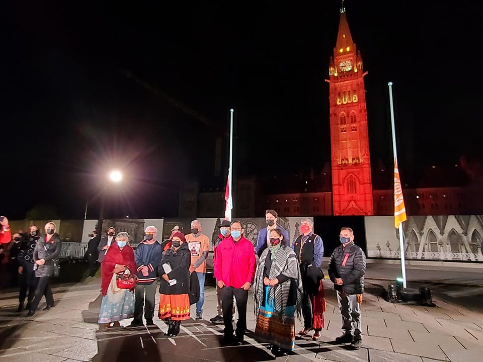 Survivors stand on Parliament Hill