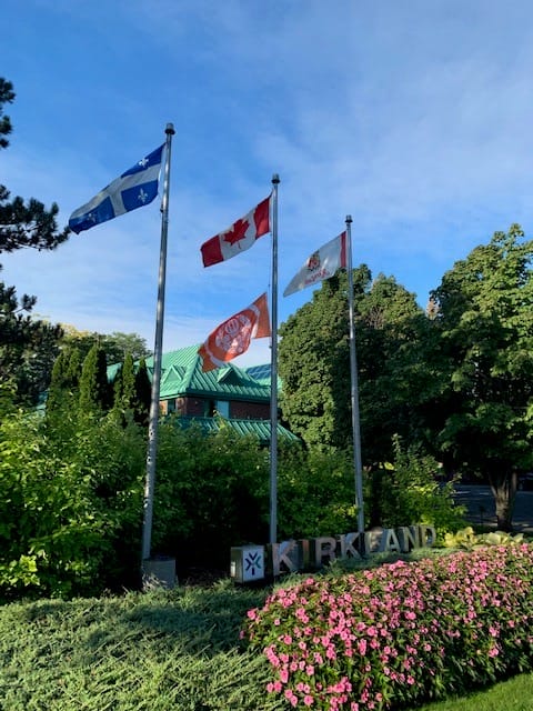 The Survivors' Flag Flying with the Canadian Flag