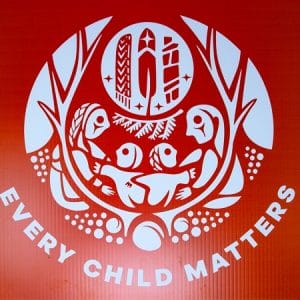 Product image of a lawn sign with the Survivors' Flag and text "Every Child Matters"