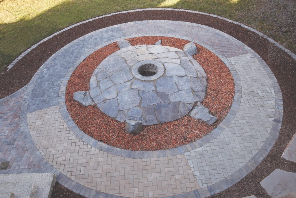 A turtle landscaping feature made of rocks and pavers at the University of Manitoba.