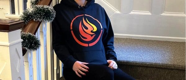 Product image of a black hooded sweatshirt with large NCTR logo on the front