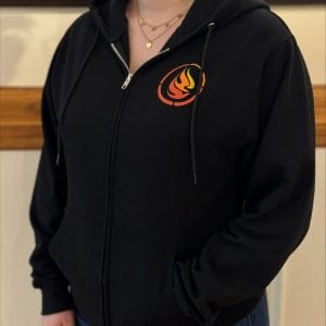 Product image of the front of a black full zip sweatshirt with the nctr logo on the front and nctr name in French and English across the back