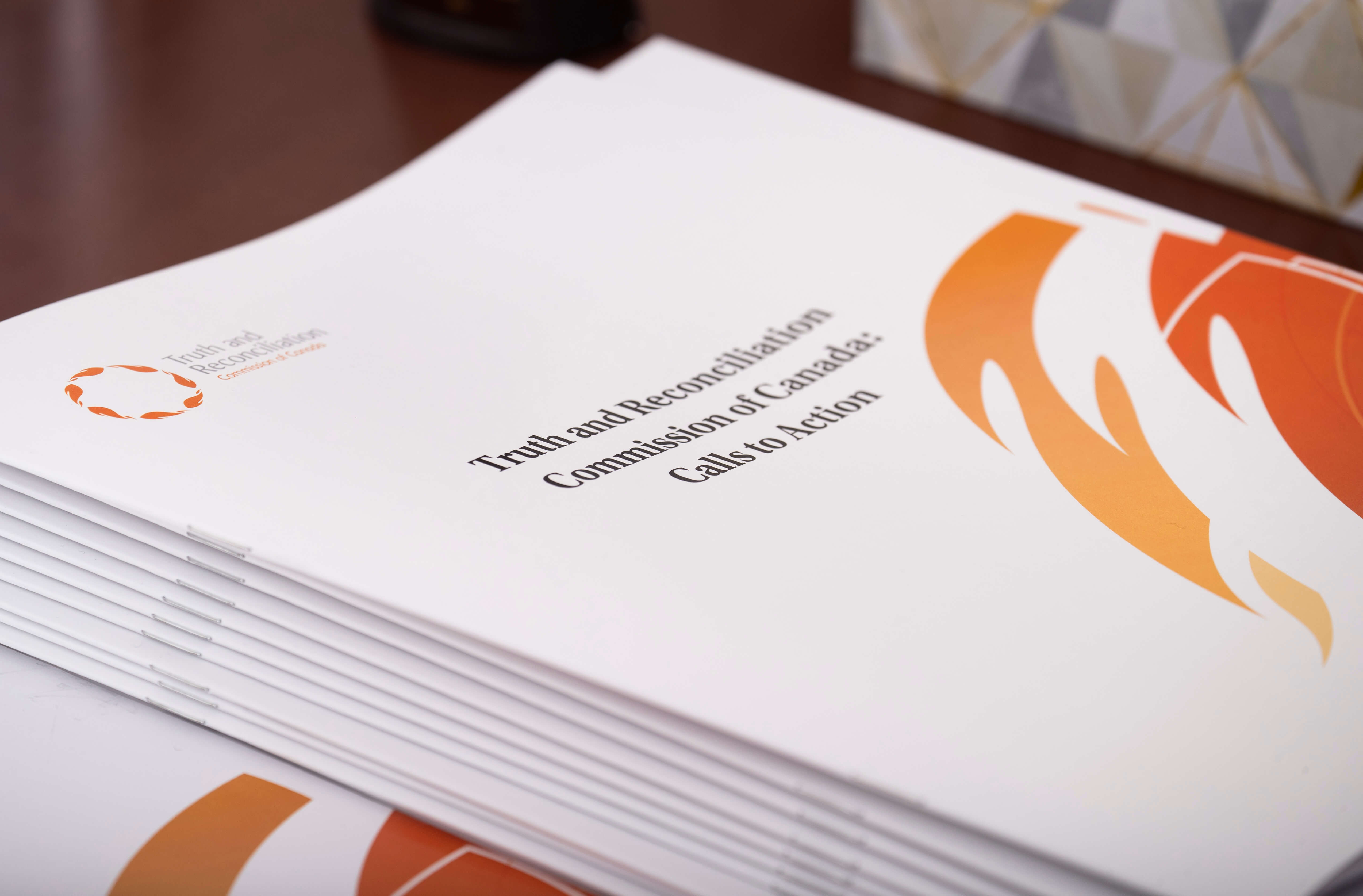 A stack of the Truth and Reconciliation Commision’s Calls to Action booklets.