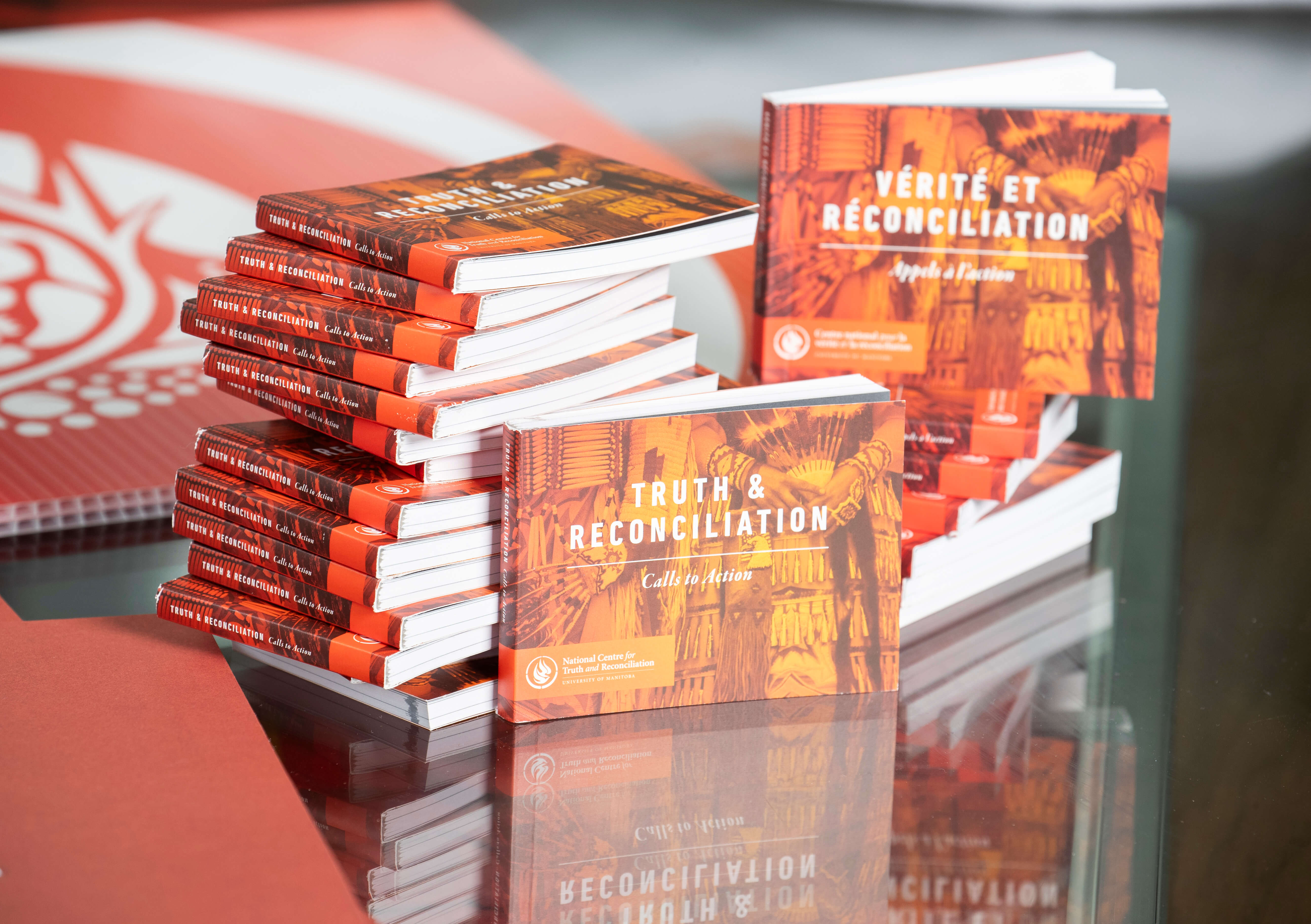 A stack of the Truth and Reconciliation Commission of Canada’s Calls to Action publication.